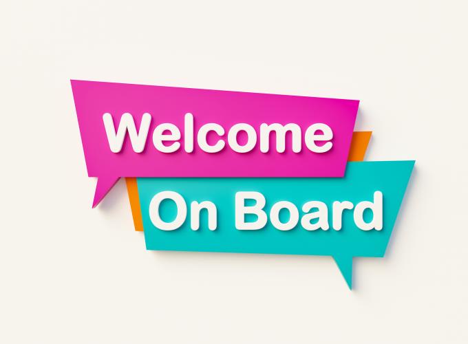 Getty Image "Welcome On Board" written in white letters and highlihted in pink and green blocks on a beige background