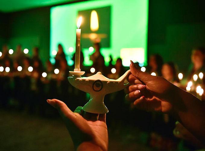 Glowing ceremonial lantern during nursing pinning ceremony