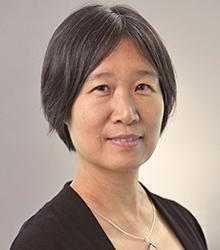 Headshot of Dr. Wenlin Michelle Huang facing at camera and wearing a black top