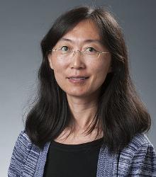 Dr. Lijun Pang wearing glasses and smiling at camera