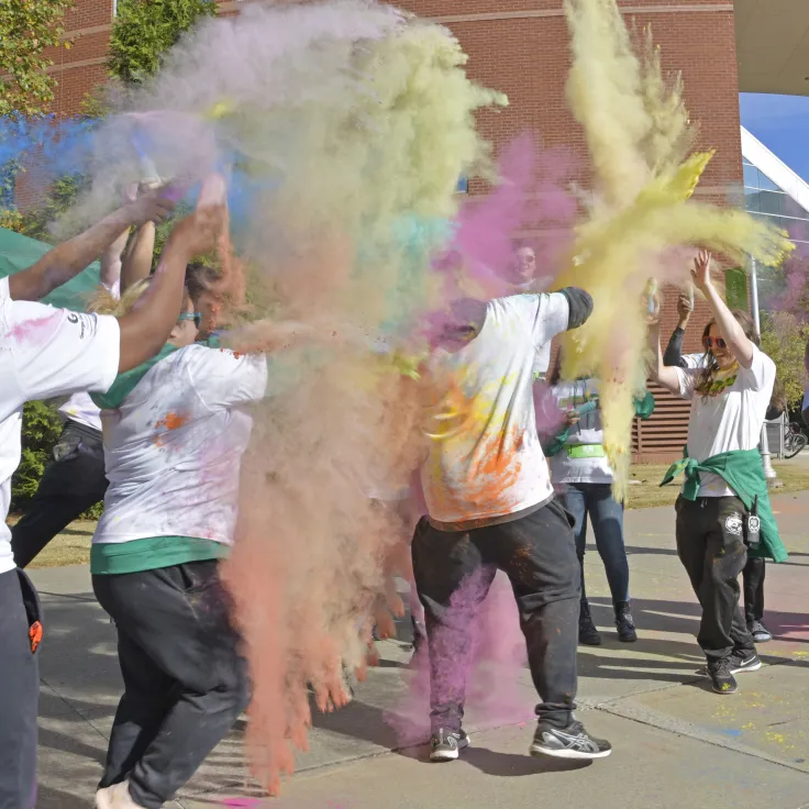 Students having fun with colored powder