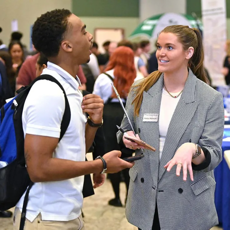 GGC student talking with employer at career fair