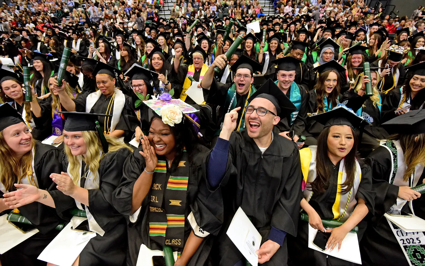 Graduates smiling during the commencement ceremony