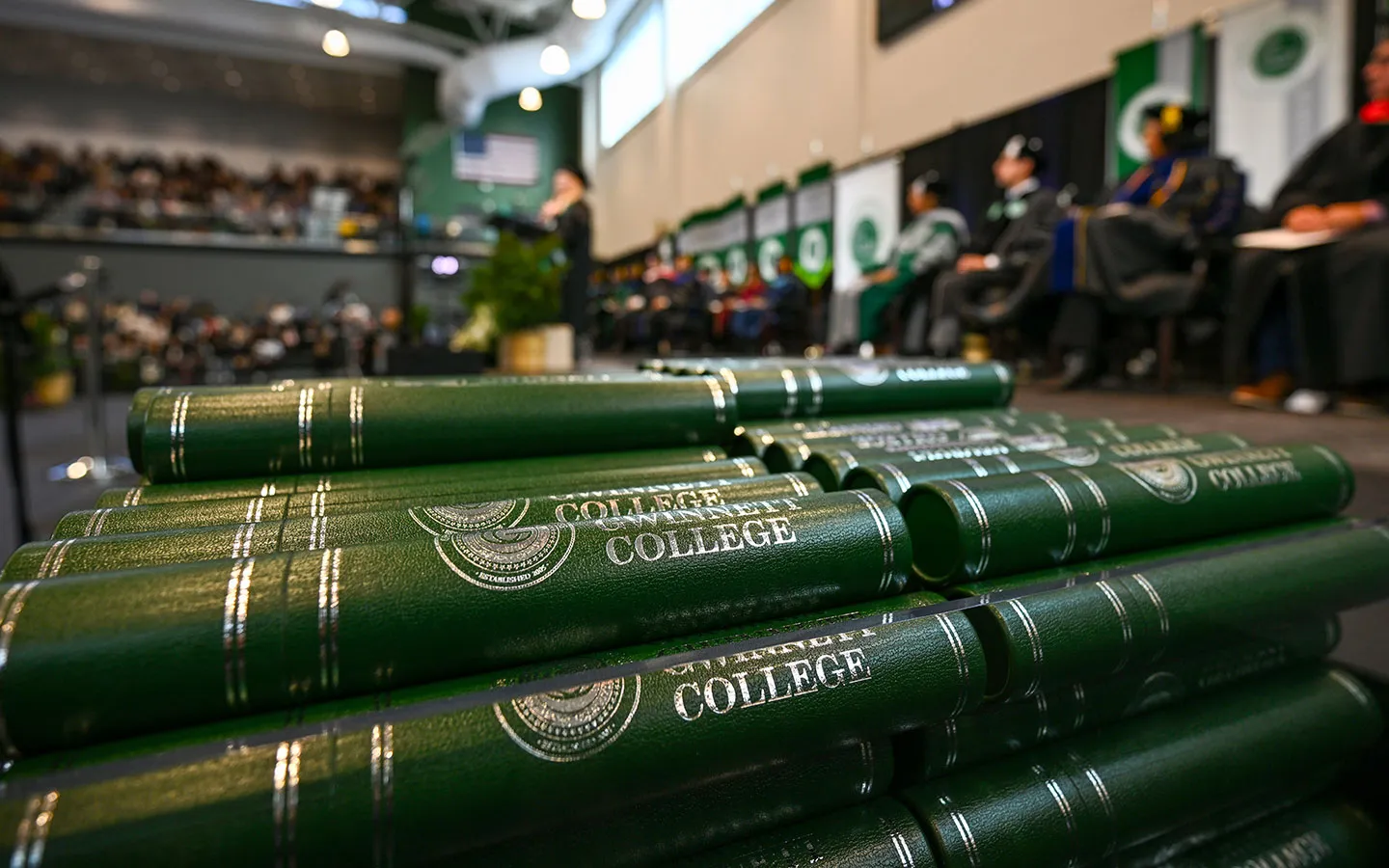 stacks of commencement diploma tubes
