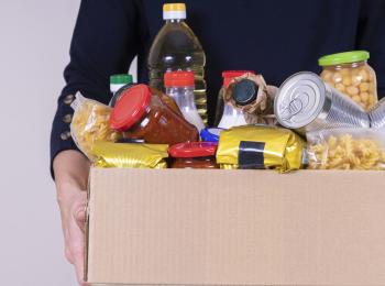 person carrying a box of food