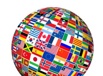 Image of a globe decorated with flags from around the world