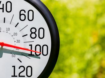 Temperature measuring tool pointed to 100 degrees 