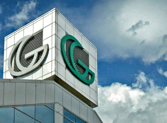 Top of GGC signature building again blue sky with billowing clouds