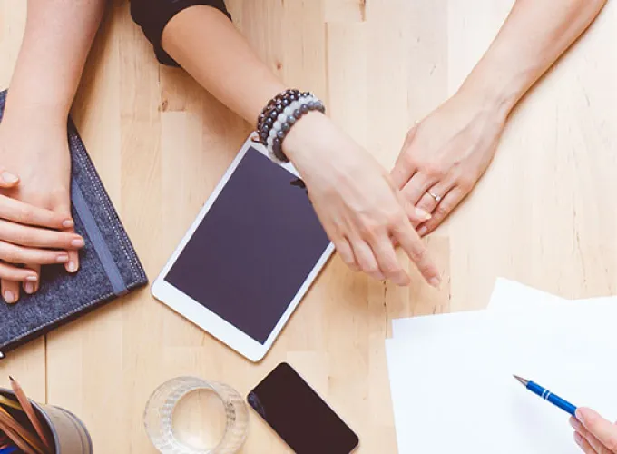 round tabletop, student hands, mobile devices