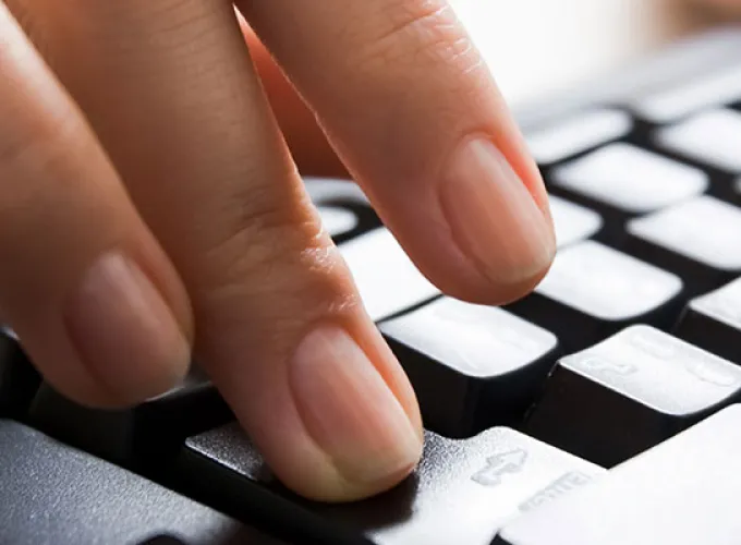 fingertips on keyboard