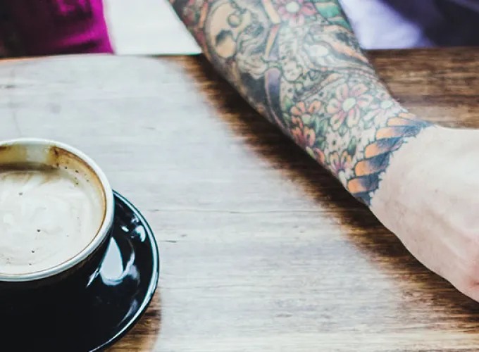 two students sharing coffee and cappuccino