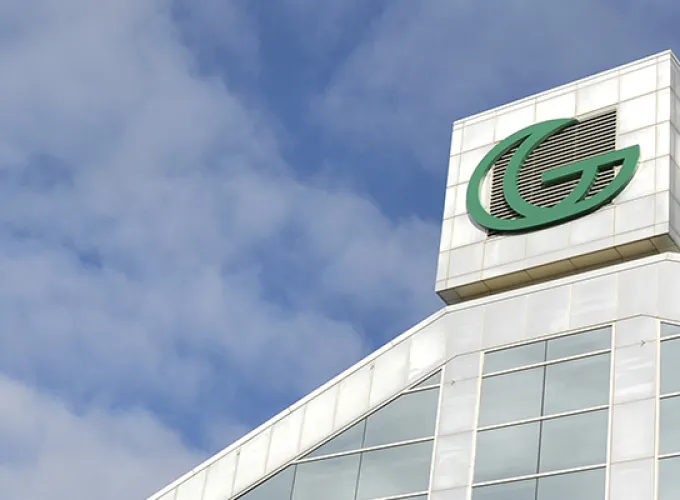 GGC signature building against cloudy blue skies