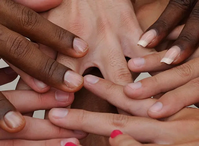 diverse student hands in center circle