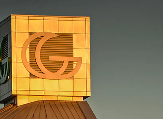 GGC signature building at sunset with full moon in background