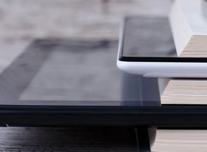 stack of books and mobile devices