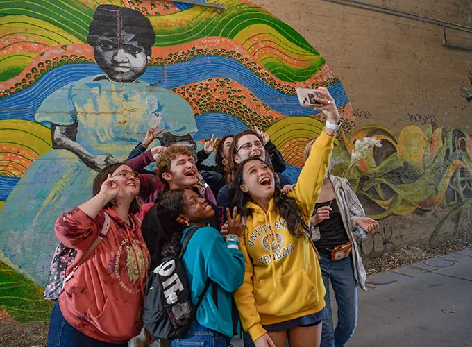 Group of Honors Program students taking a selfie in Atlanta's Krog Street tunnel