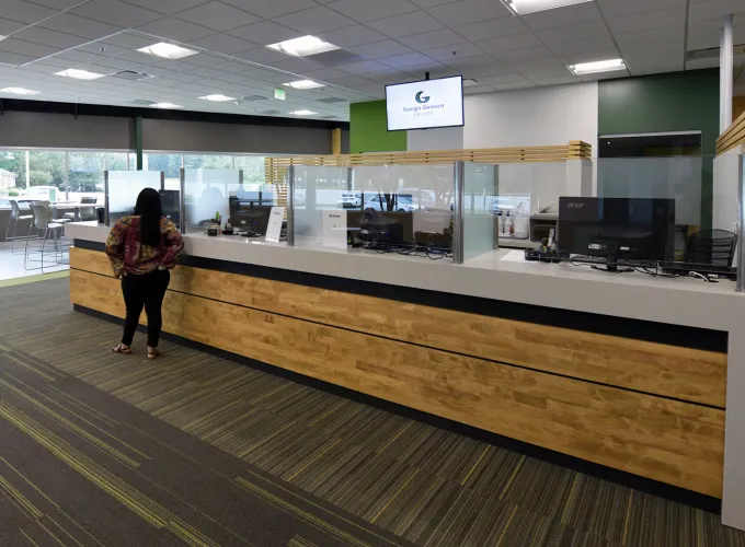 Person waiting at a welcome desk
