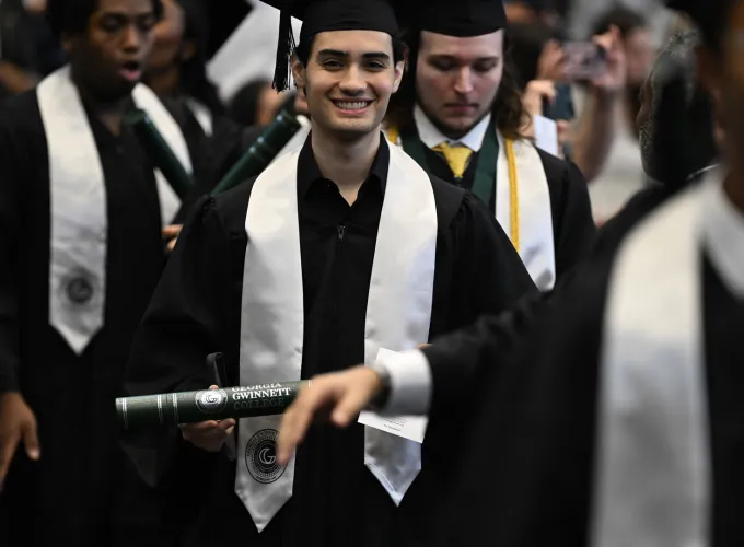 Graduates walking to their seats
