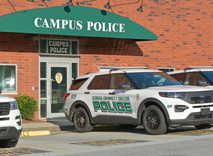Police cars parked in front of the Campus Police building