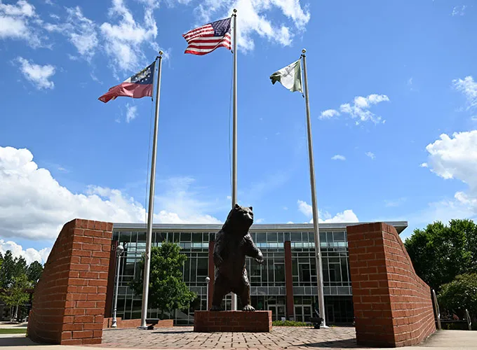 Grizzly statue in front of the Student Center on a sunny day