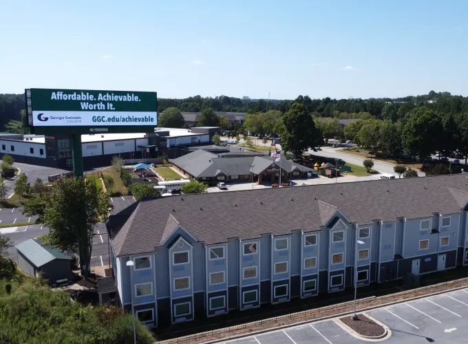 Back of I Building with a GGC billboard beside it. 