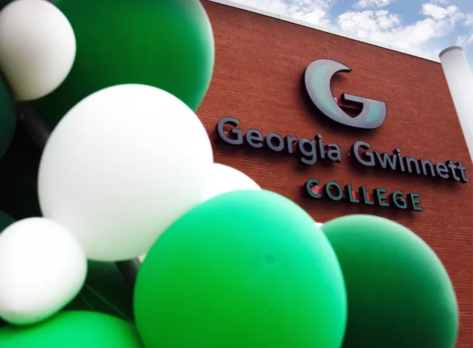 GGC logo on a red brick building