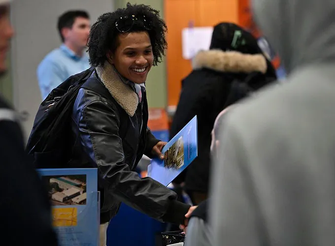 GGC student shaking hands with an employer at GGC's Career Fair