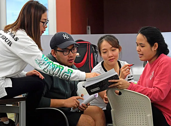 group of students collaborating in the library study area