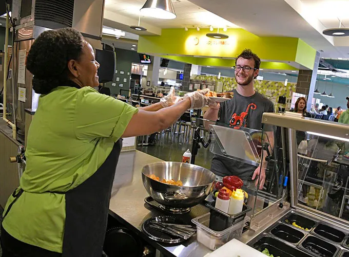 GGC student getting food at the Dining Hall