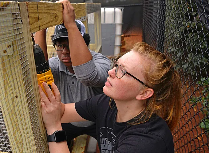 GGC students building composting bin
