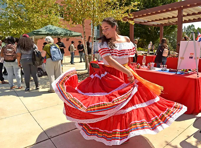 Latin dancer twirling red traditional skirt