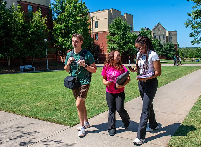 Student residents walking outdoors near student housing