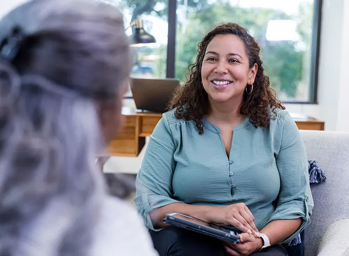Therapist in seated session with one person