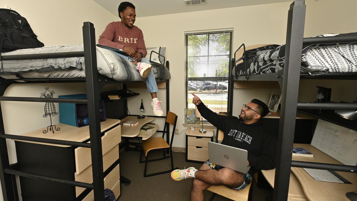 Two students in student housing room