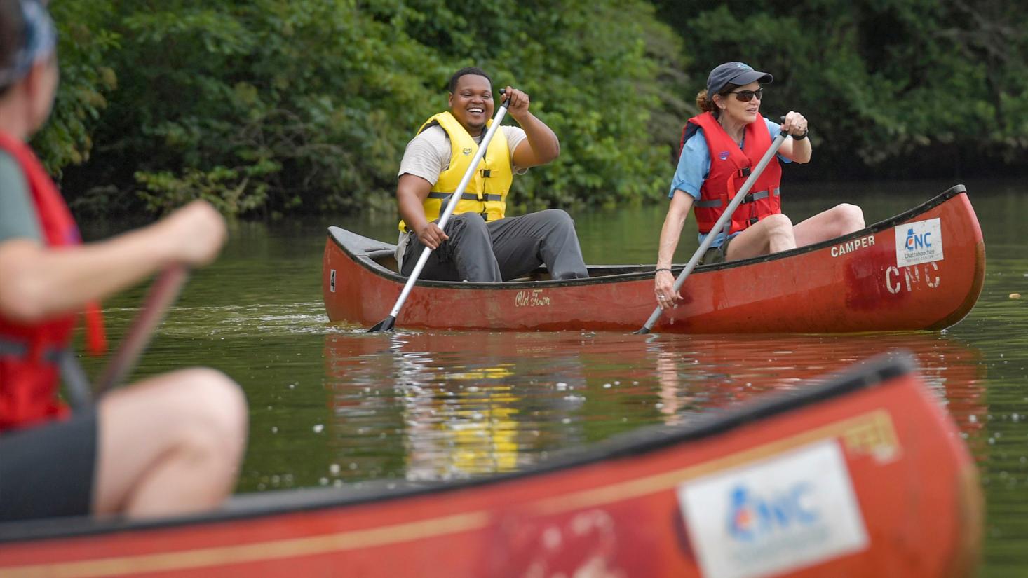 people in a canoe on a lake
