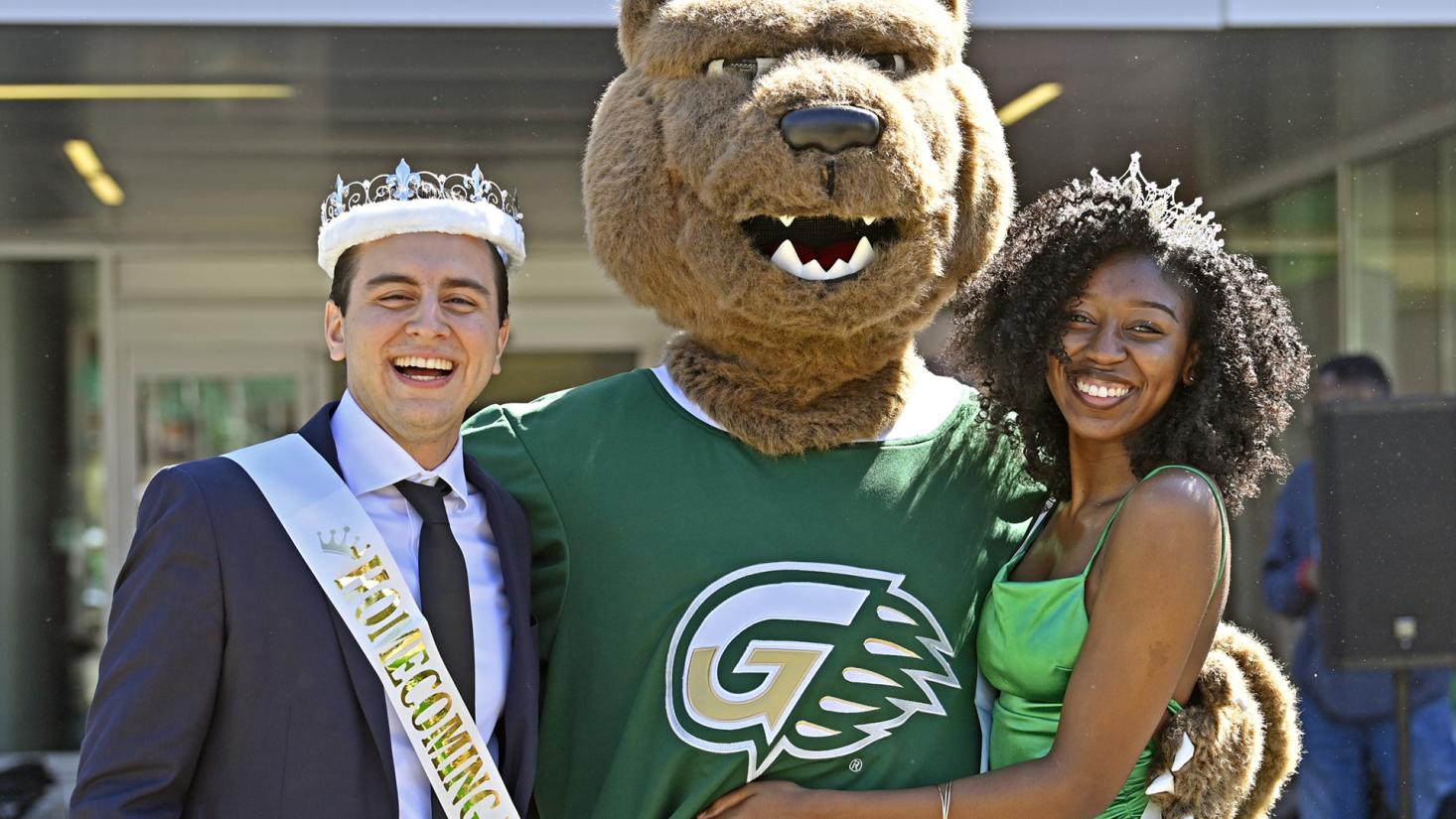 Two students wearing crowns