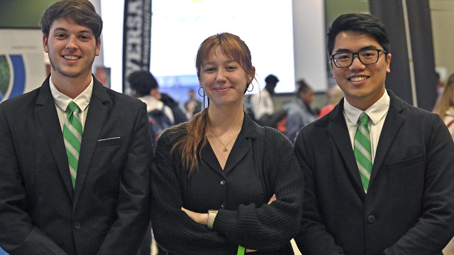 Three students in business suits