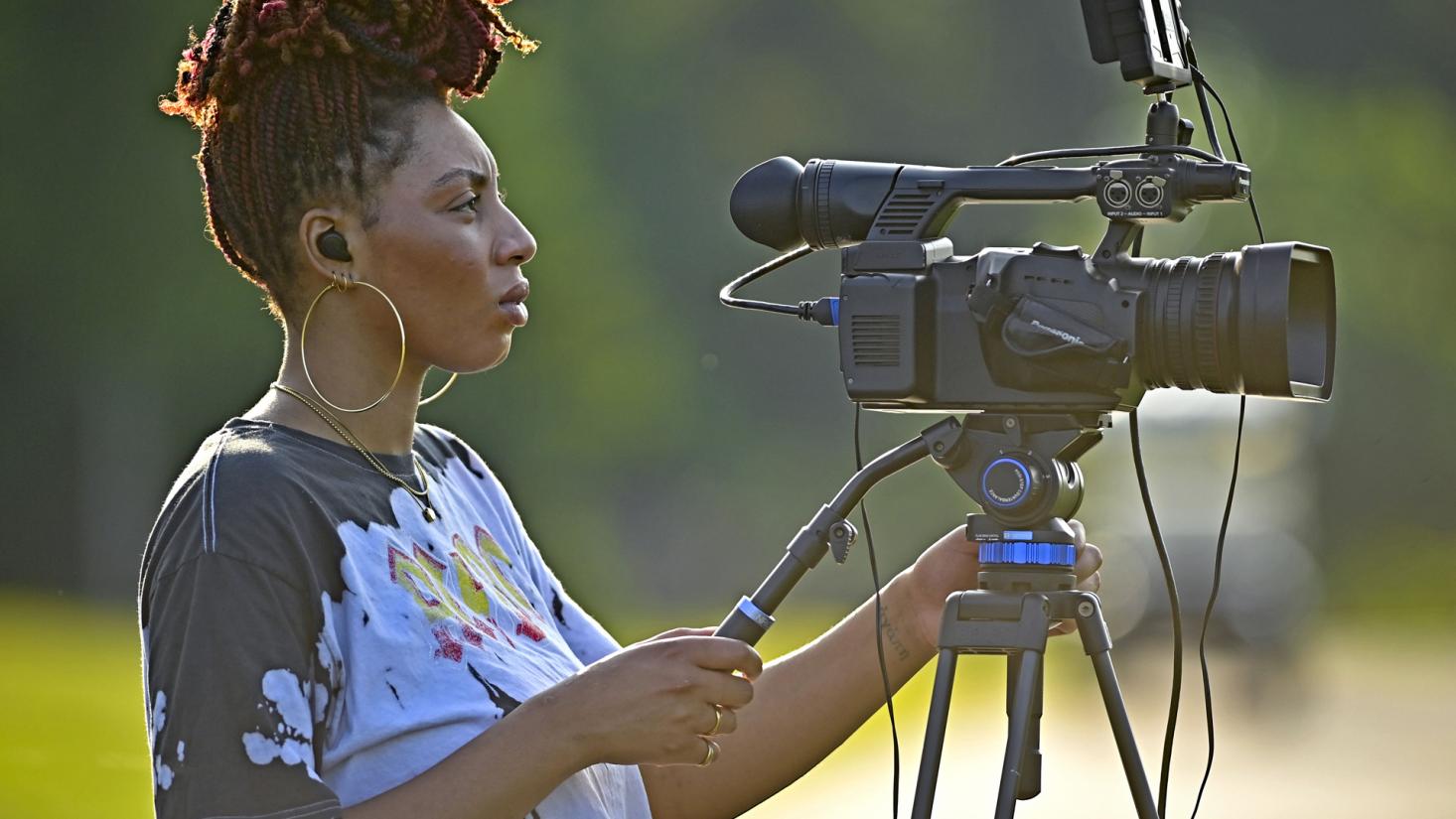 Woman holding video camera