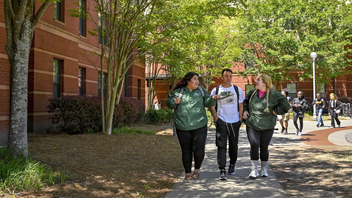 Students walking outside of Student Housing