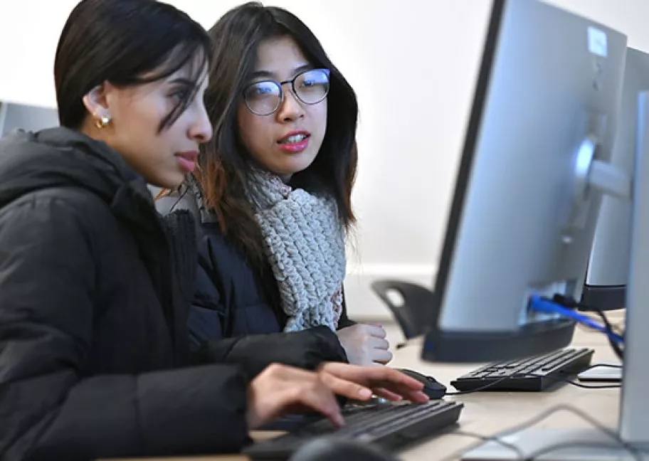 Mai Duong and Nabaa Ahmed collaborate on coding during the Winter 2025 Java Boot Camp