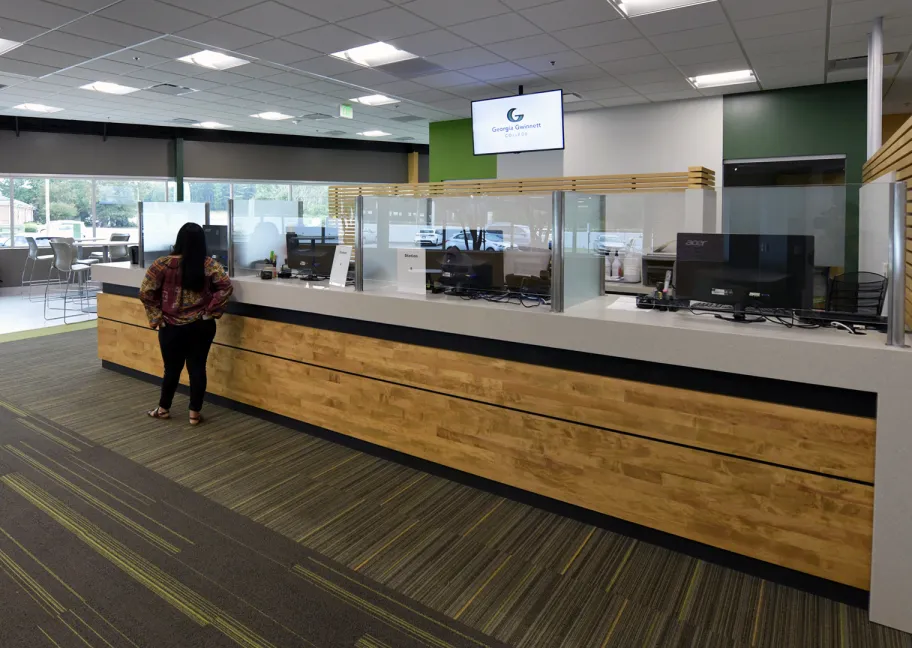 Person waiting at a welcome desk
