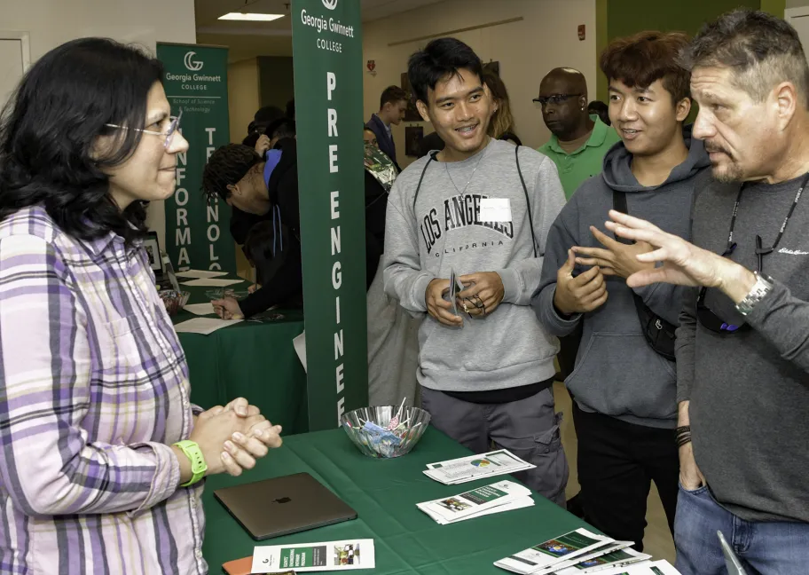 Group talking to professor