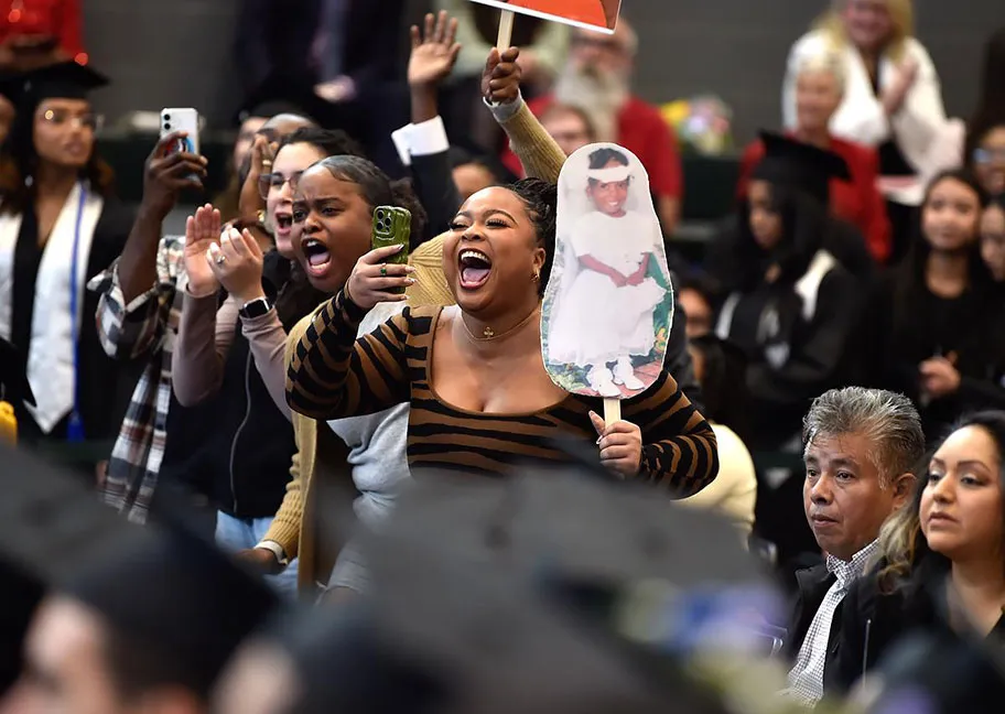 Cheering family in the audience at 2025 fall commencement