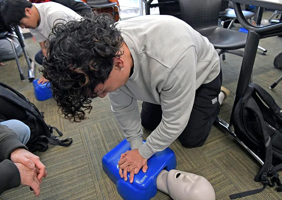 GGC students learning and practicing CPR