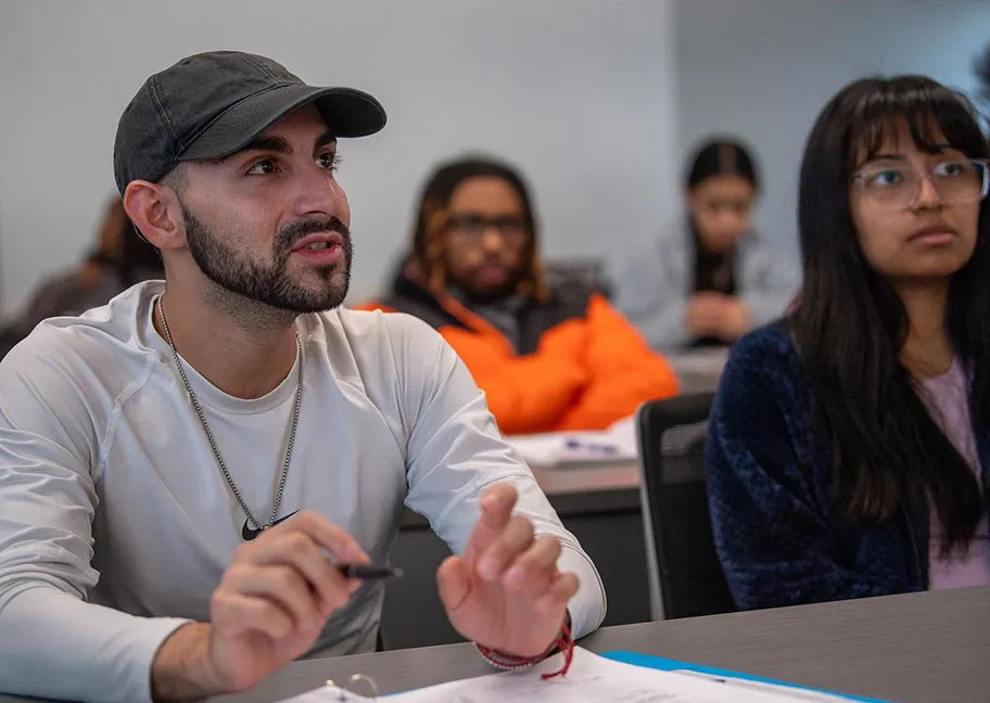 Attentive students seated in criminology course classroom