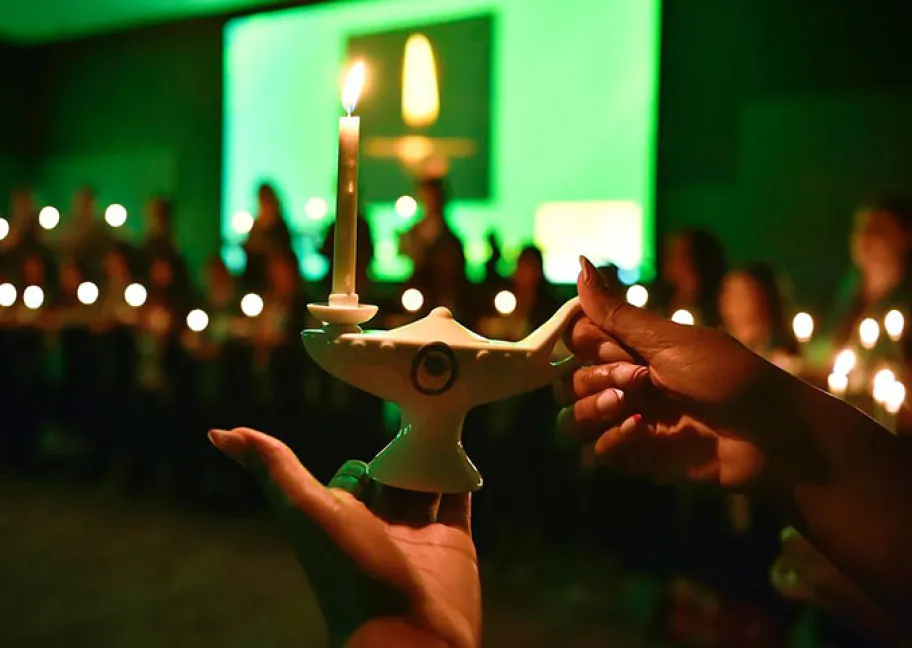 Glowing ceremonial lantern during nursing pinning ceremony