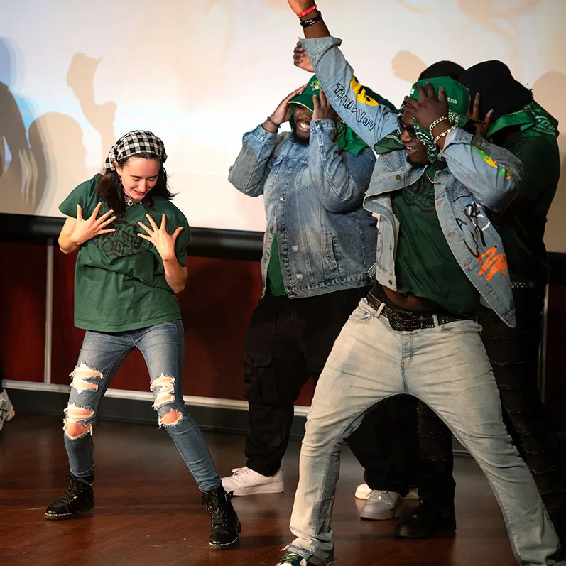 students acting in a theater production