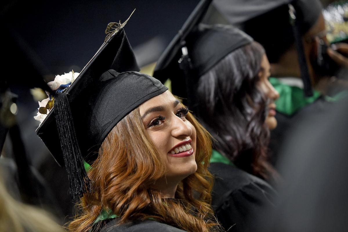 Graduating student in cap and gown