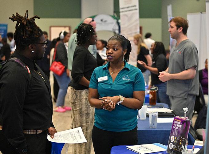 employer talking with students at GGC's Career Fair