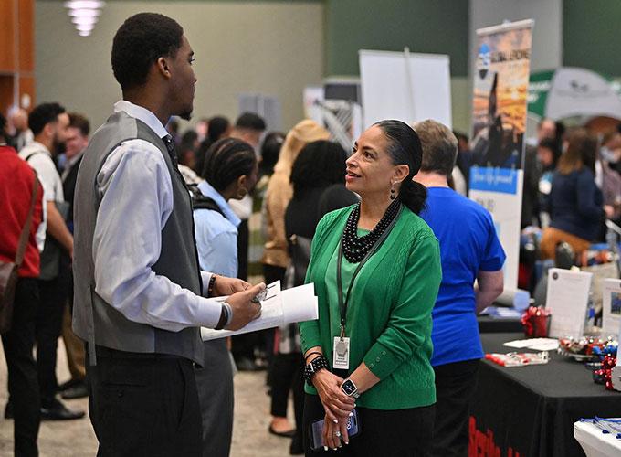 employer talking with students at GGC's Career Fair